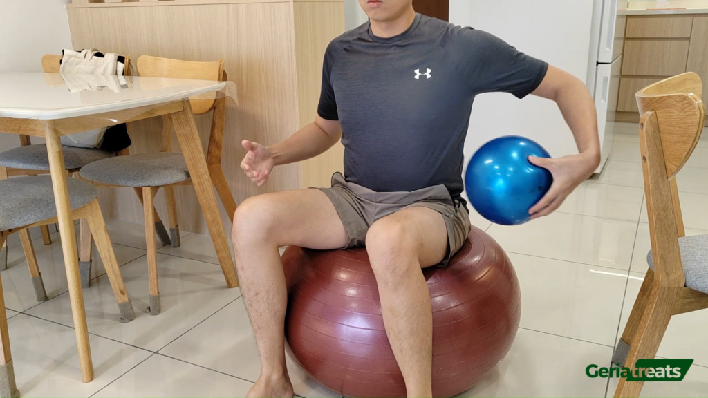 113 Passing a ball around waist whilst on a stability ball